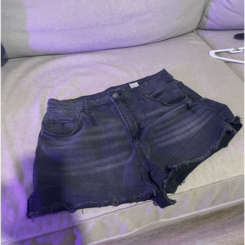 Black frayed shorts.